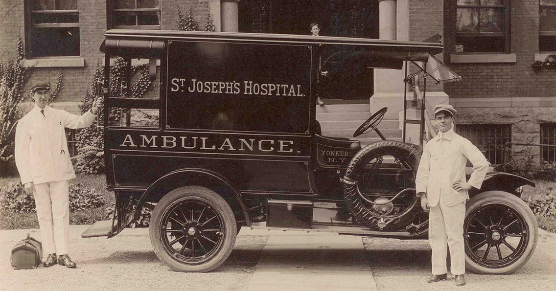 SJCM-ambulance old fashioned St. Joseph's ambulance with two attendants
